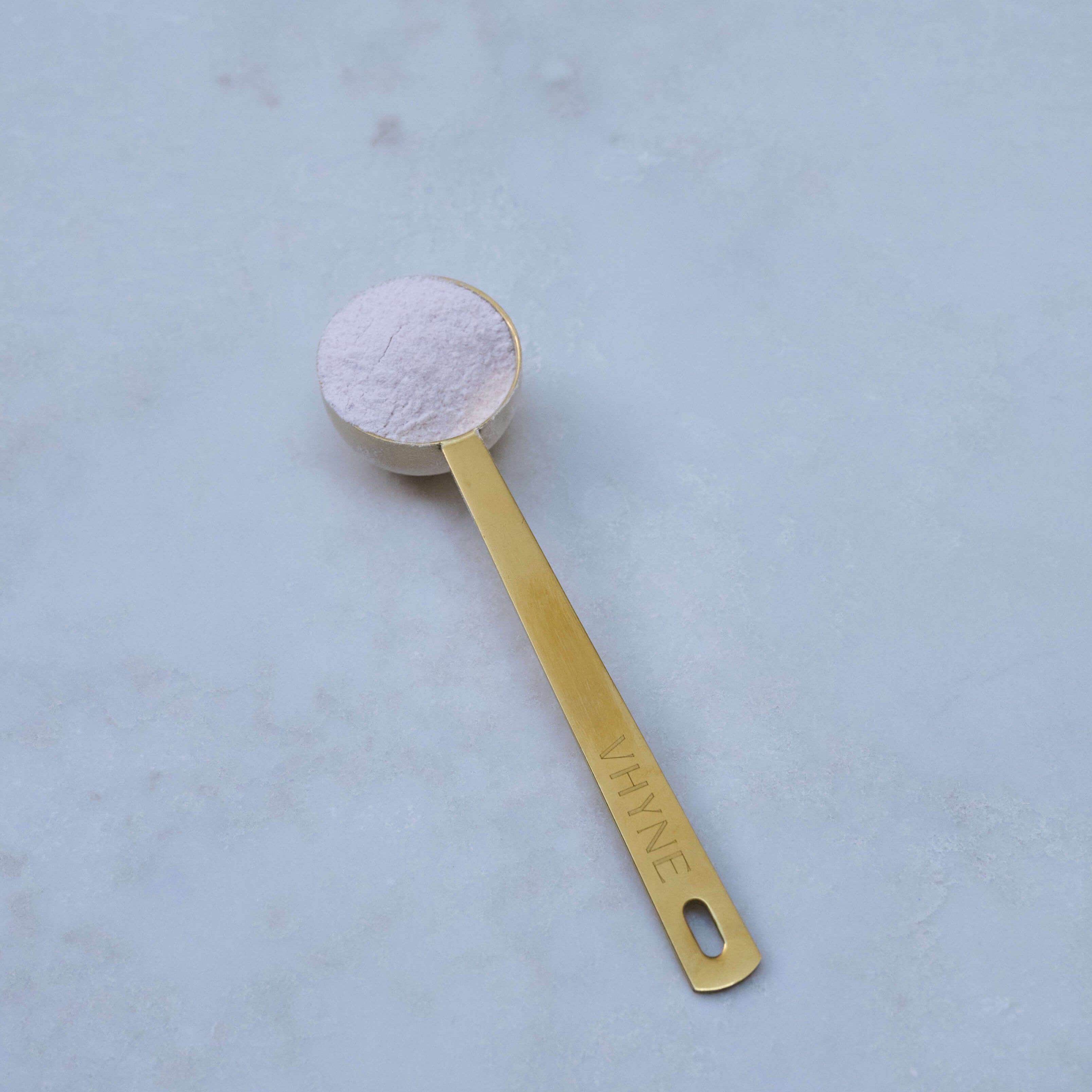 Vhyne Stainless steel Antique brass
finish Vhyne branded supplement scoop with VitaResilience powder